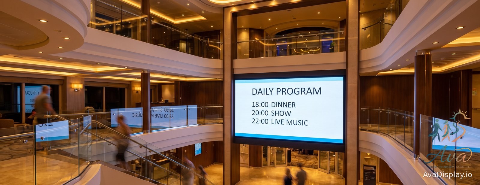 A large lit screen showing the daily program in a cruise ship atrium
